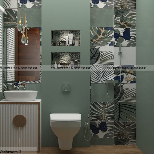 Sage green washroom interior design with botanical leaf tiles and floating toilet in Dwarka by SPL Interiors