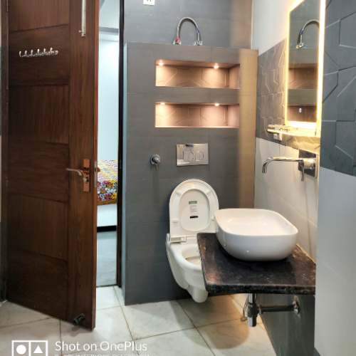 Cozy bathroom with natural light and simple decor.