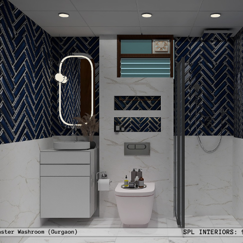 Master washroom design with navy blue chevron tiles and marble accents in Gurgaon by SPL Interiors